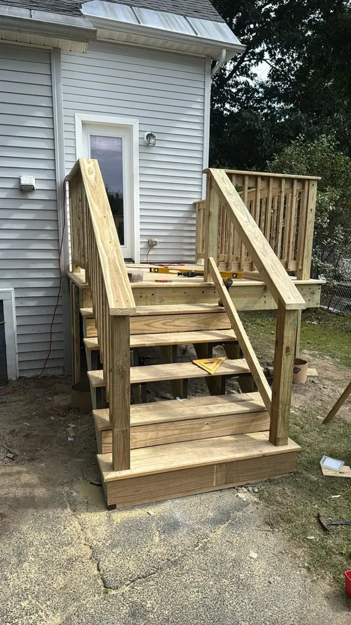 Deck stair railing installation in progress